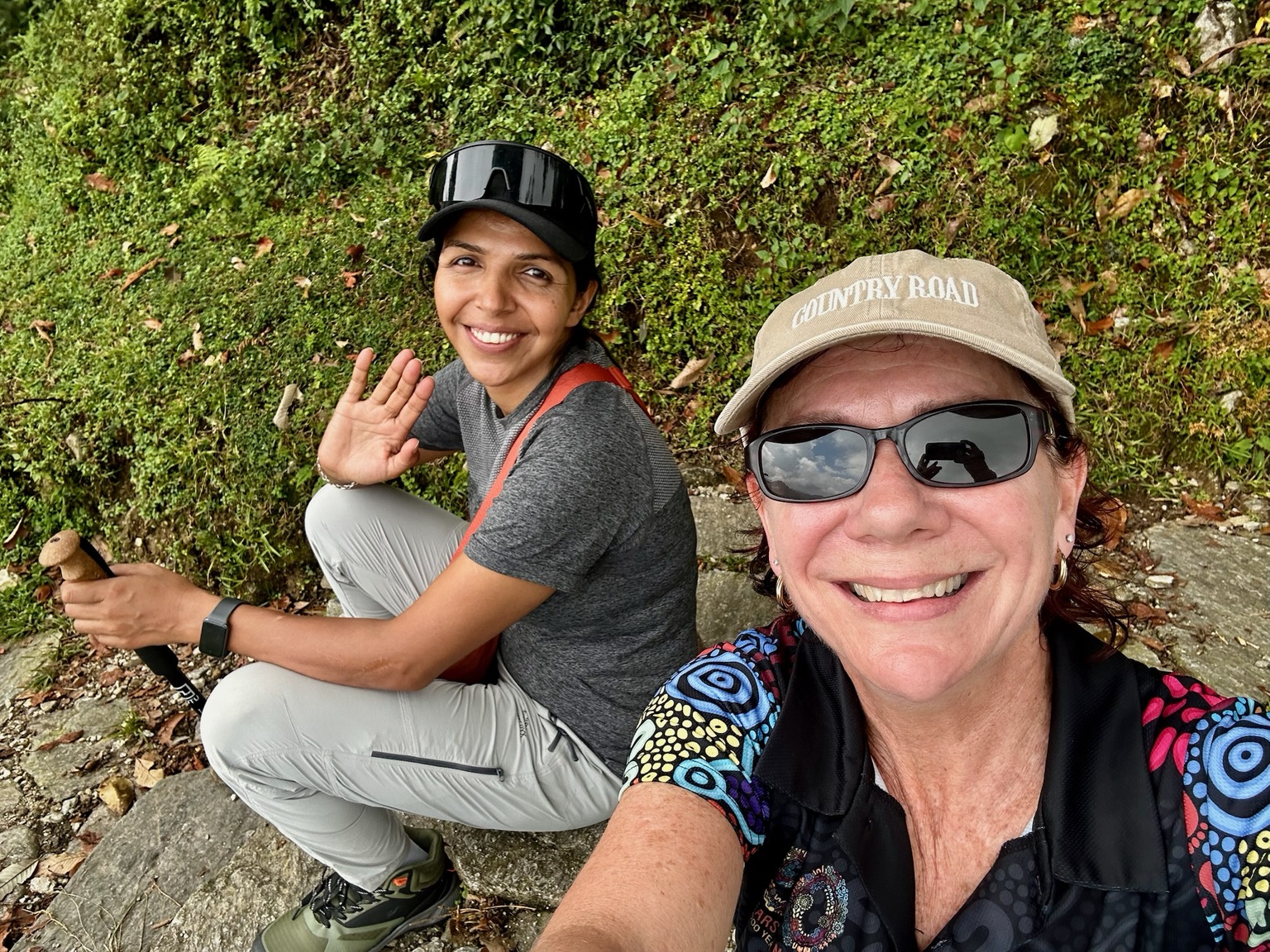 Sital and a trekker sharing a break on the trail